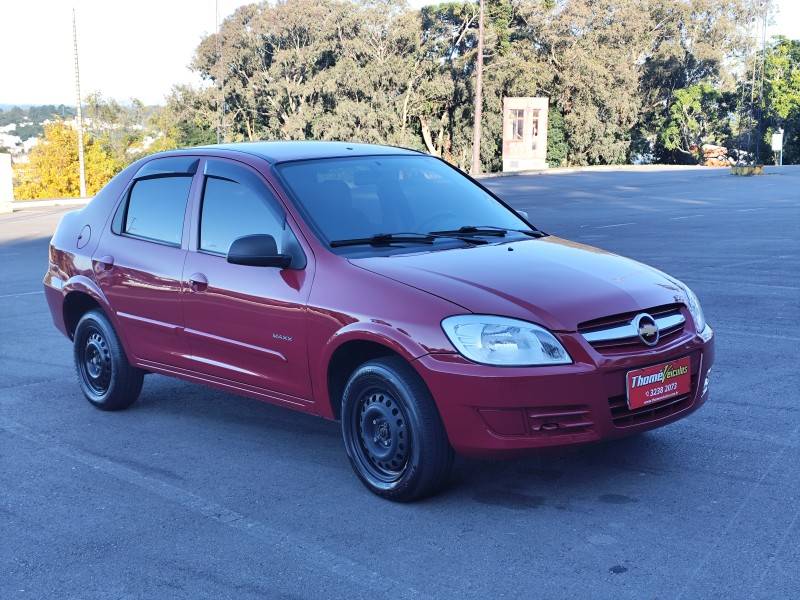 CHEVROLET - PRISMA - 2010/2011 - Vermelha - R$ 29.900,00